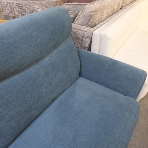 1519 - A teal blue upholstered dual electric reclining sofa RRP £1799