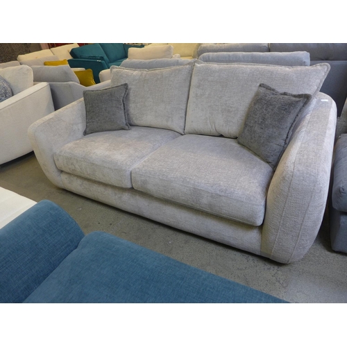 1520 - A silver velvet three seater sofa on semi-exposed hardwood frame