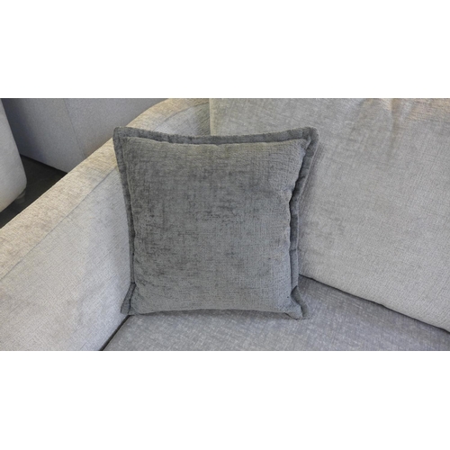 1520 - A silver velvet three seater sofa on semi-exposed hardwood frame