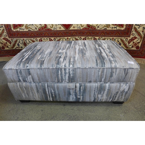 1524 - A blue, grey and cream upholstered footstool RRP £459