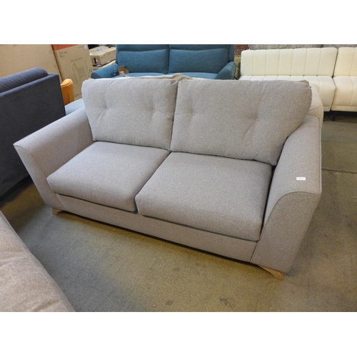 1527 - A grey upholstered three seater sofa