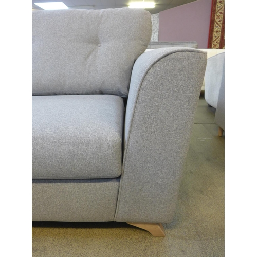 1527 - A grey upholstered three seater sofa