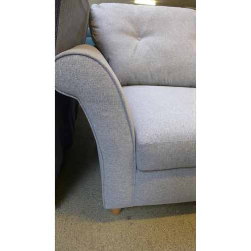 1528 - A grey upholstered three seater sofa