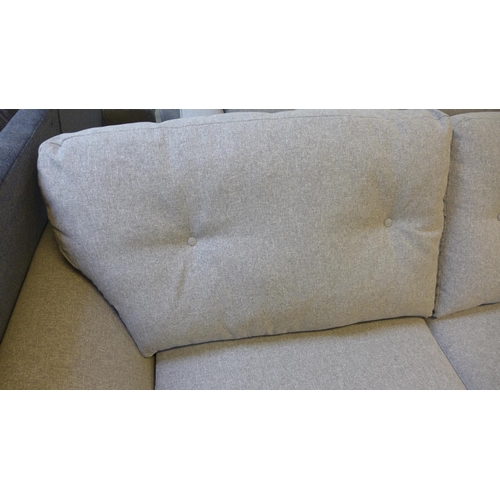 1528 - A grey upholstered three seater sofa