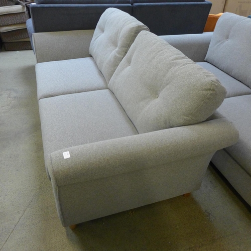 1528 - A grey upholstered three seater sofa