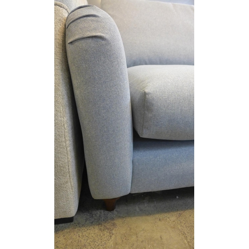 1529 - A grey upholstered three seater sofa