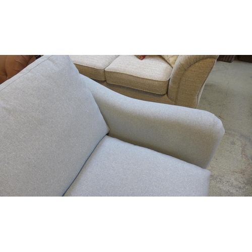 1529 - A grey upholstered three seater sofa