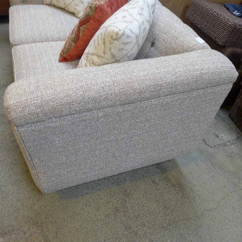 1536 - An oatmeal upholstered two seater buttoned sofa with contrasting scatter cushions RRP £999