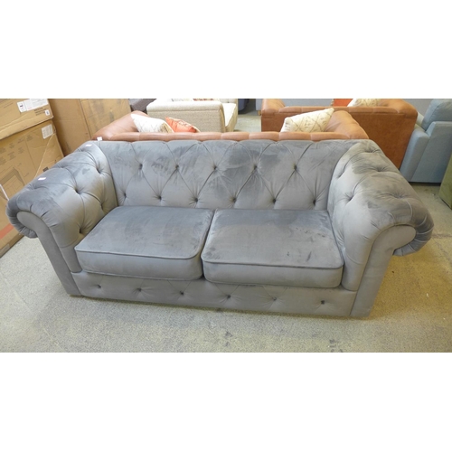 1537 - A grey velvet Chesterfield three seater sofa