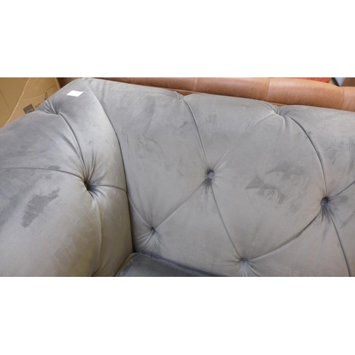 1537 - A grey velvet Chesterfield three seater sofa