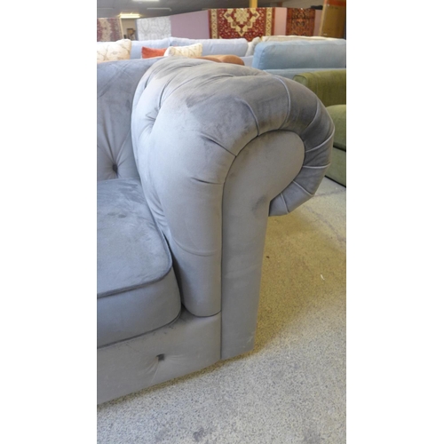 1537 - A grey velvet Chesterfield three seater sofa