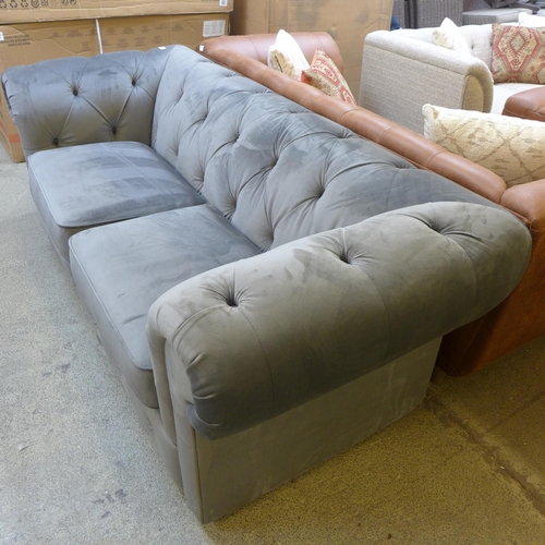 1537 - A grey velvet Chesterfield three seater sofa