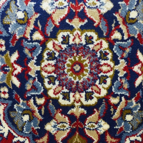 1543 - An ivory ground Cashmere carpet, full pile, 300 x 200