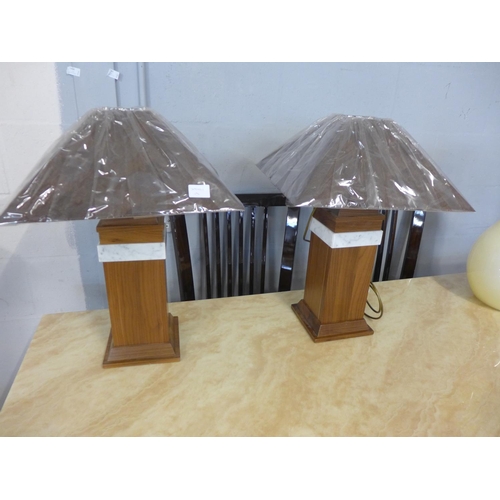 1566 - A pair of walnut and marble table lamps