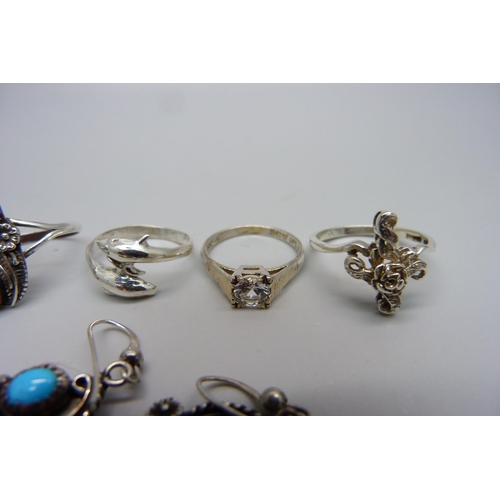 1003 - A silver stone set ring, Q, and matching earrings set and three silver rings, M, N and Q