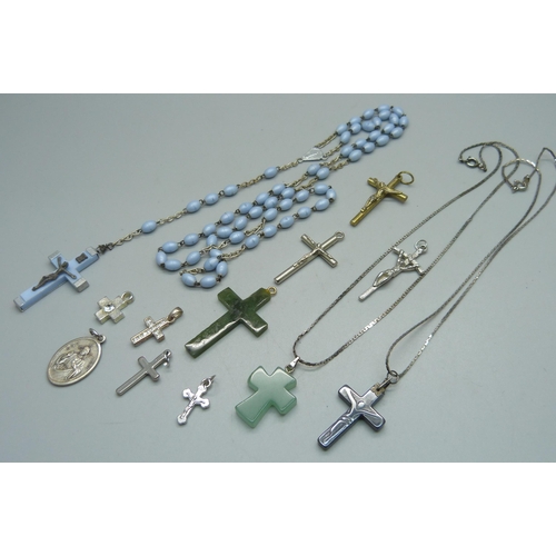 1017 - Ten cross pendants, a St. Christopher pendant and a set of rosary beads