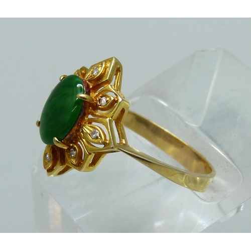 1028 - A 14ct gold and green stone ring also set with eight small diamonds, 3.5g, O/P, marked 585