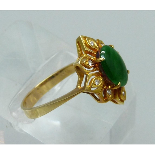 1028 - A 14ct gold and green stone ring also set with eight small diamonds, 3.5g, O/P, marked 585