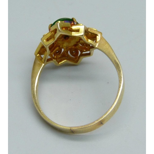 1028 - A 14ct gold and green stone ring also set with eight small diamonds, 3.5g, O/P, marked 585