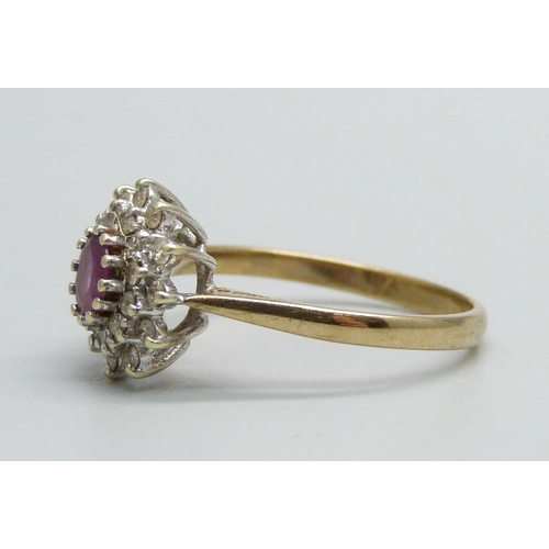 1029 - A 9ct gold, ruby and diamond cluster ring, 2.6g, R