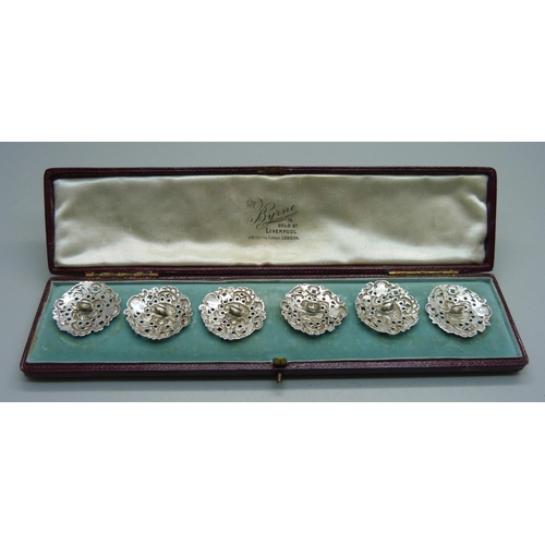 1044 - A cased set of six Victorian ornate silver buttons, Birmingham 1900, by Levi and Salaman, 28mm