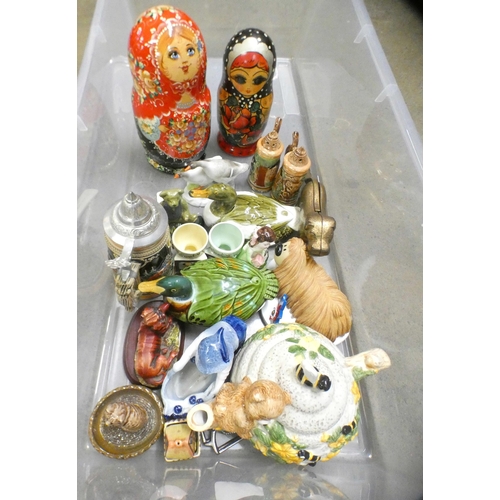 1066 - Two boxes of assorted glass and china, Russian dolls, brass dog nutcrackers, large Portuguese duck c... 