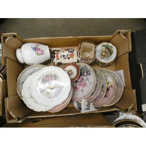 1112 - Six boxes of collectors plates, Sadler teapots and two display cabinets with miniature clocks and or... 