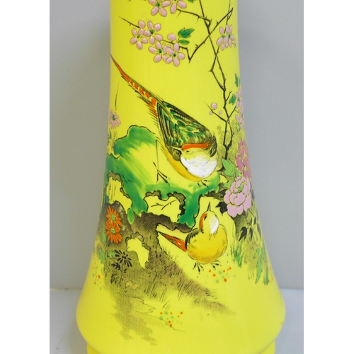 601 - A Shelley hand painted enamelled vase, 21cm