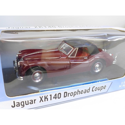 607 - Two Sun Star metal die-cast model vehicles; a Ford Focus WRC and Jaguar 140 Drophead Coupe, boxed