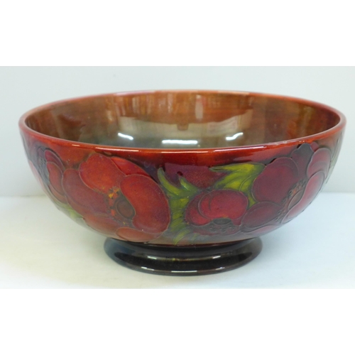 613 - An early 20th Century Moorcroft bowl, anemone pattern with flambe glaze, signed on the base, 23.5cm,... 