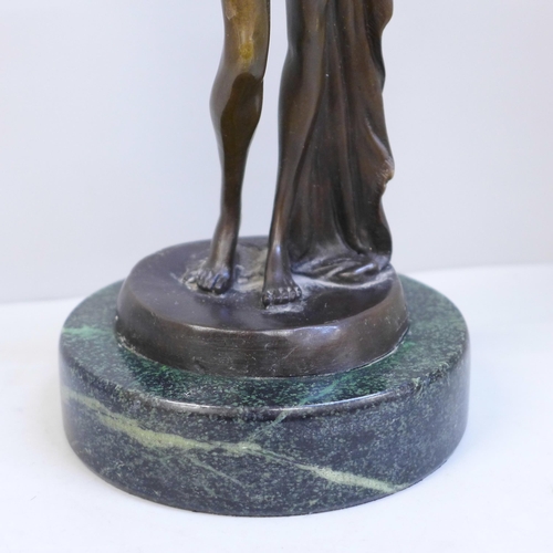 614 - A bronze statue of a lady on a marble base, signed, 30cm