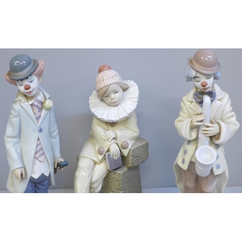 617 - Four Lladro figures including a model of a Nativity cow