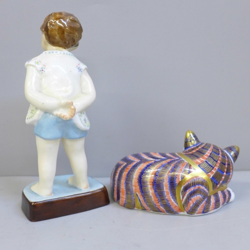 628 - A Royal Crown Derby cat paperweight and a Royal Worcester 'Tommy' figure