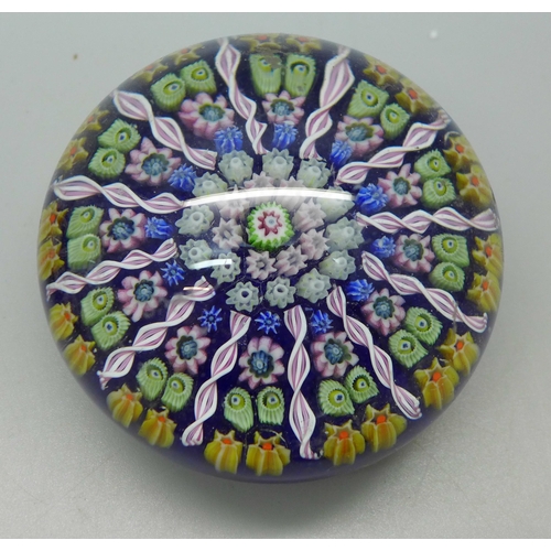 634 - Four Millefiori glass paperweights