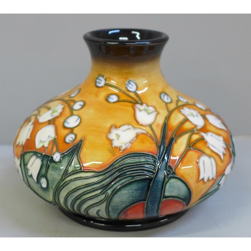 635 - A limited edition Moorcroft Lily of The Valley vase, 245/500, 10.5cm