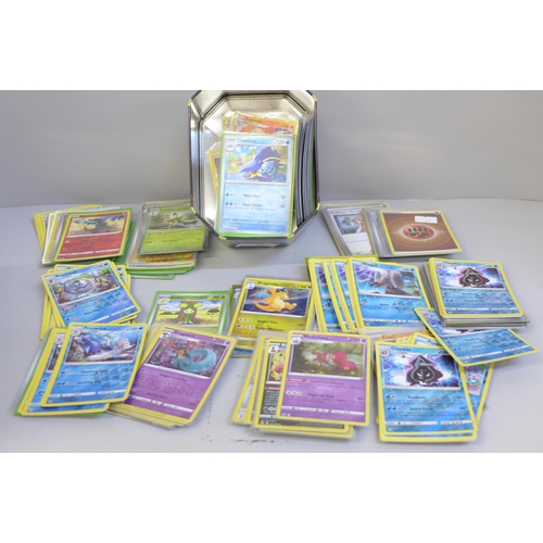 648 - Over 400 holographic Pokemon cards and a tin