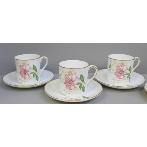 652 - Six Shelley coffee cans and saucers decorated with flowers