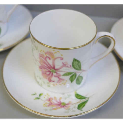 652 - Six Shelley coffee cans and saucers decorated with flowers