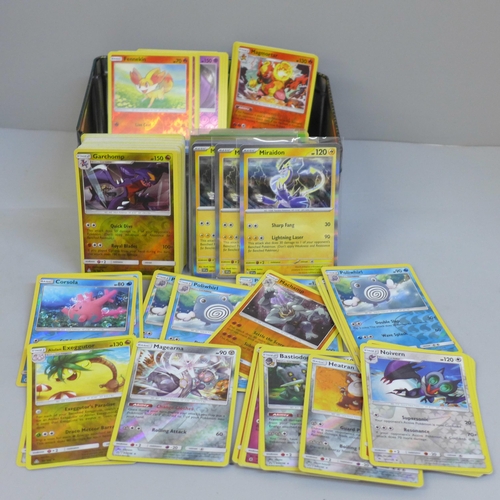 663 - Over 240 reverse holo Pokemon cards in collectors tin