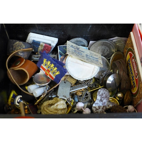 688 - A wooden box containing coins, watches, badges, buttons, etc.