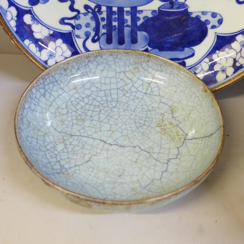 694 - A Chinese bowl with four character mark to base, a Chinese blue and white dish with six character ma... 