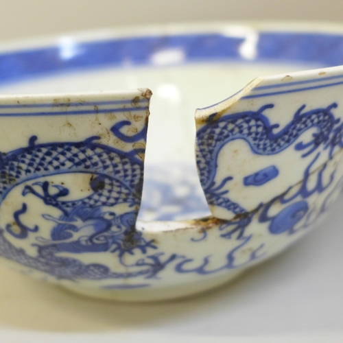 694 - A Chinese bowl with four character mark to base, a Chinese blue and white dish with six character ma... 