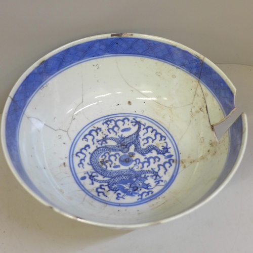 694 - A Chinese bowl with four character mark to base, a Chinese blue and white dish with six character ma... 