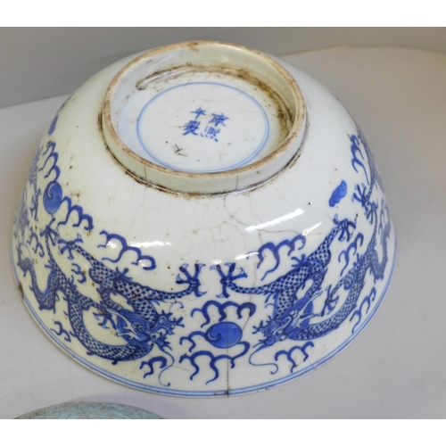 694 - A Chinese bowl with four character mark to base, a Chinese blue and white dish with six character ma... 