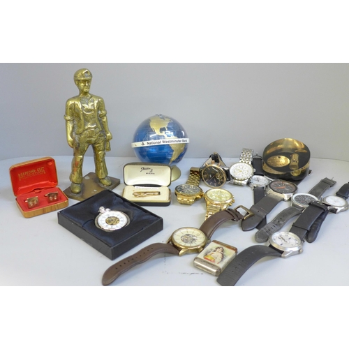 709 - A collection of wristwatches including Michael Kors, a cast brass figure, a vesta case, paperweight,... 