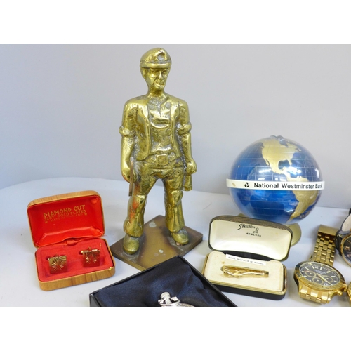 709 - A collection of wristwatches including Michael Kors, a cast brass figure, a vesta case, paperweight,... 