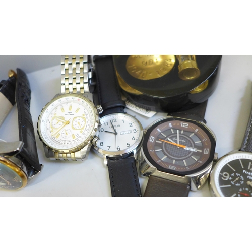 709 - A collection of wristwatches including Michael Kors, a cast brass figure, a vesta case, paperweight,... 