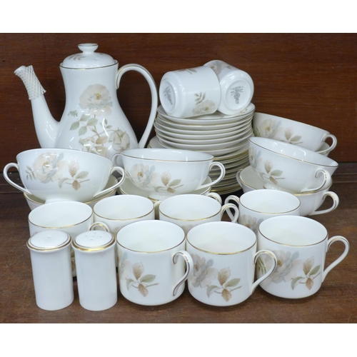 710 - A Royal Doulton Yorkshire Rose eight setting coffee service, lacking one saucer, one additional cup ... 