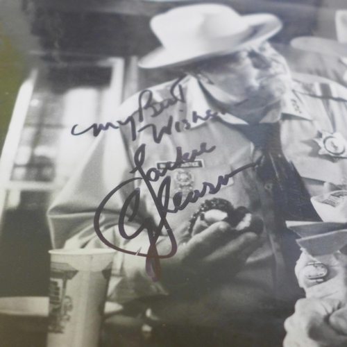 720 - An autograph picture collection; Jackie Gleason, Fabian, Edward Woodward, Charles Gray, Efram Zimbal... 