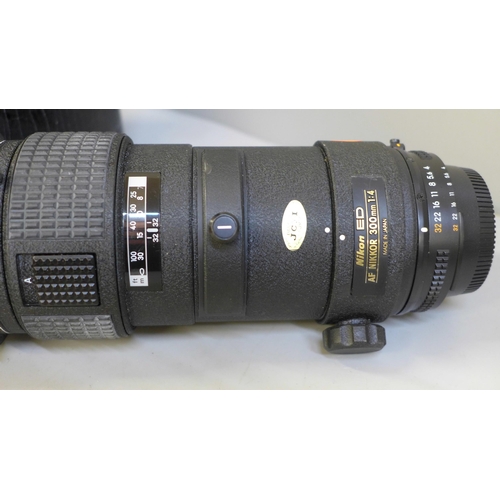 767 - A Nikon ED AF Nikkor 300mm 1:4 telephoto lens with case